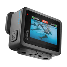 Rugged action camera showing side ports and front display