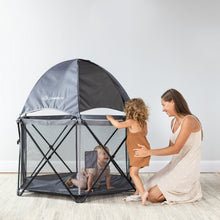 Gray mesh toddler playard with dome canopy, front opening, and dark interior base