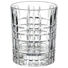 Faceted clear whiskey chiller glass tumbler with a geometric ribbed pattern