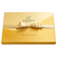 Gold chocolate gift box with ribbon bow and Godiva Gold Collection label