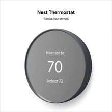 Dark charcoal smart thermostat display, shows Heat set to 70 and Indoor 72