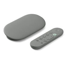 Streaming media streamer and voice remote, gray with rounded design and button layout.