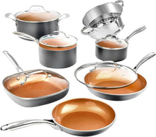 Ceramic cookware set with stainless exteriors and copper nonstick interiors