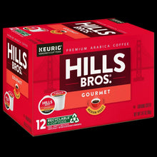 Hills Bros. Gourmet medium roast K-Cup® pods carton angled on dark background.