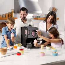 Automatic soft serve ice cream maker on kitchen counter with cone and cups