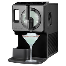 Automatic soft serve maker dispensing white soft serve into a coupe glass