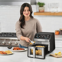 Digital air fryer on countertop with two visible drawers and viewing windows