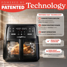 Black air fryer with front window showing food and control panel, countertop view