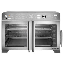 Stainless steel countertop oven with two open French doors and interior heating area