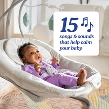 Baby seated in white cushioned swing with overhead star mobile and seat frame