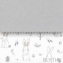 Light gray plush baby swing cover with bunny and leaf line pattern