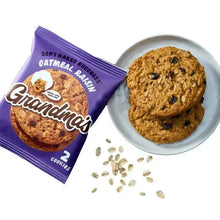 Oatmeal raisin cookie set: packet, two cookies, and cookie bits on a plate