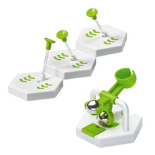 Marble run track section with white bases and green chutes for marbles