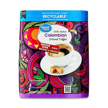 Ground coffee pouch with colorful Colombian design and cup graphic