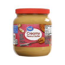 Creamy peanut butter jar with red lid, Great Value label
