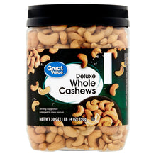 Whole cashew jar with black lid and green label, filled with beige cashew pieces