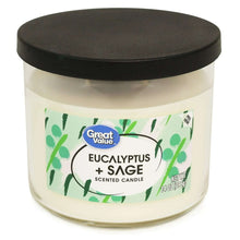 Great Value eucalyptus & sage scented candle, clear jar, green leaf label, dark round lid