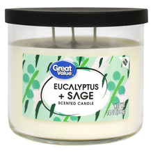 Eucalyptus + sage scented candle in clear glass jar with black lid