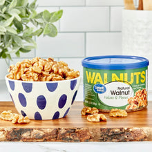 Walnut halves & pieces container with bowl of walnuts beside it