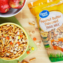 Peanut butter flavored trail mix, bowl of mix and bag packaging