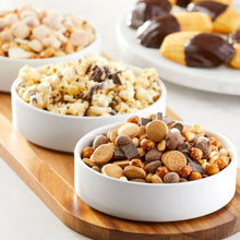 S'mores trail mix served in bowls with chocolate pieces and nuts