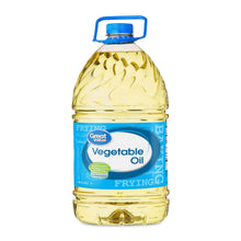 Vegetable oil bottle with blue cap and label, filled with pale yellow oil.