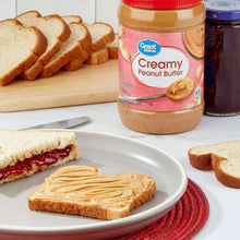 Creamy peanut butter jar with red lid and Great Value label; beige contents.