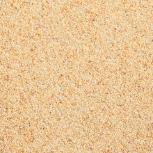 Beige garlic powder granules, fine textured seasoning
