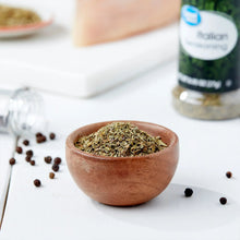 Dried Italian seasoning herbs in a terracotta bowl