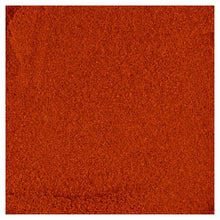 Ground paprika spice, fine orange-red powder.