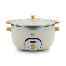 Cream slow cooker with glass lid and gold-tone side handles; removable pot design