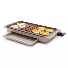 GreenPan electric griddle with warming drawer, open lid with eggs, bacon and sliced cakes