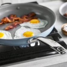 GreenPan The Big Fry blue pan with fried eggs and bacon, showing its long handle