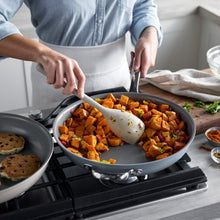 GreenPan The Big Fry blue pan with helper handle, cooking diced vegetables