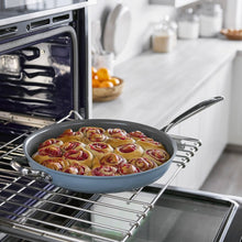 GreenPan The Big Fry 14-inch blue pan with helper handle, holding baked rolls