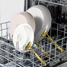 Cream skillet set of three in dishwasher rack with gold-tone handles