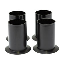 Pair of black metal rack feet with circular openings and side tabs