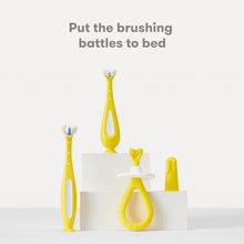 Yellow grow-with-me toothbrush set with suction-cup stand and multiple bristle heads