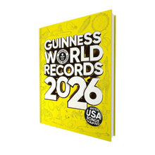 Hardcover Guinness World Records 2026 book with yellow illustrated cover