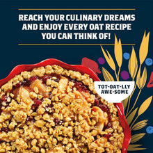 Red bowl of oatmeal with dark berry topping and crunchy oat crumble