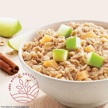Bowl of instant oatmeal topped with green apple pieces