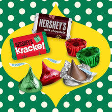Assorted chocolate candies in foil and paper wrappers with Hershey’s and Reese’s logos
