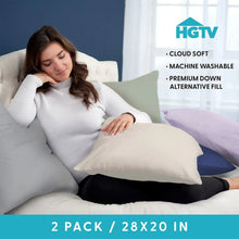 Lavender 2-pack cloud bed pillows, 20x28 in, shown on a bed with person