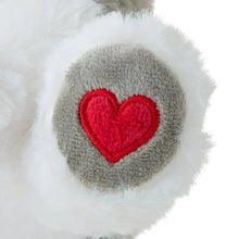Gray plush paw with red heart patch, close-up