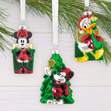 Four Mickey and friends blown glass ornaments on hooks, green tree and present styles