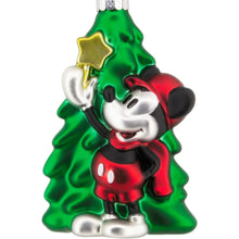 Mickey Mouse blown glass ornament in green tree with red bow and gold star