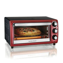 Red countertop toaster oven with open glass door, showing a pizza on the rack