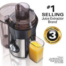 Juice extractor with clear container and juice cup on the side
