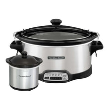 Stainless steel slow cooker with clear lid, side handles, and digital control base