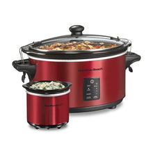 Red programmable slow cooker with clear lid, removable stoneware crock, and side handles